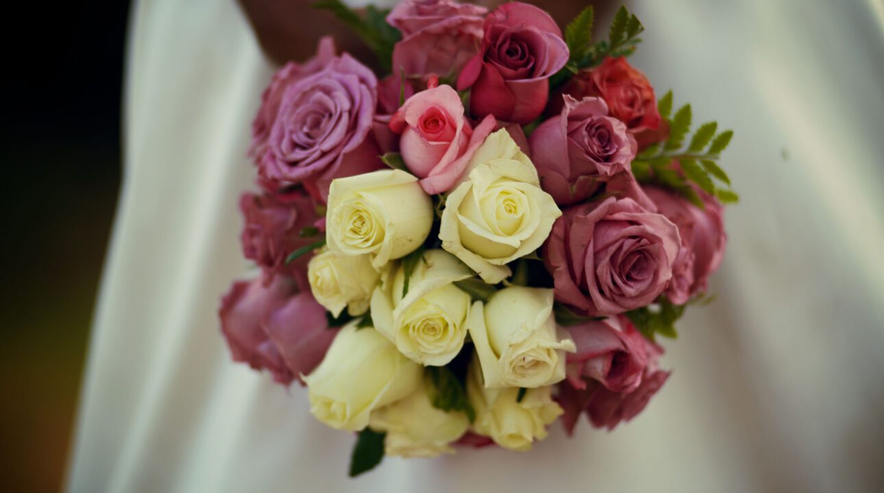 Woman holding a bouqet of flowers at Baraka Roses Ngorika.