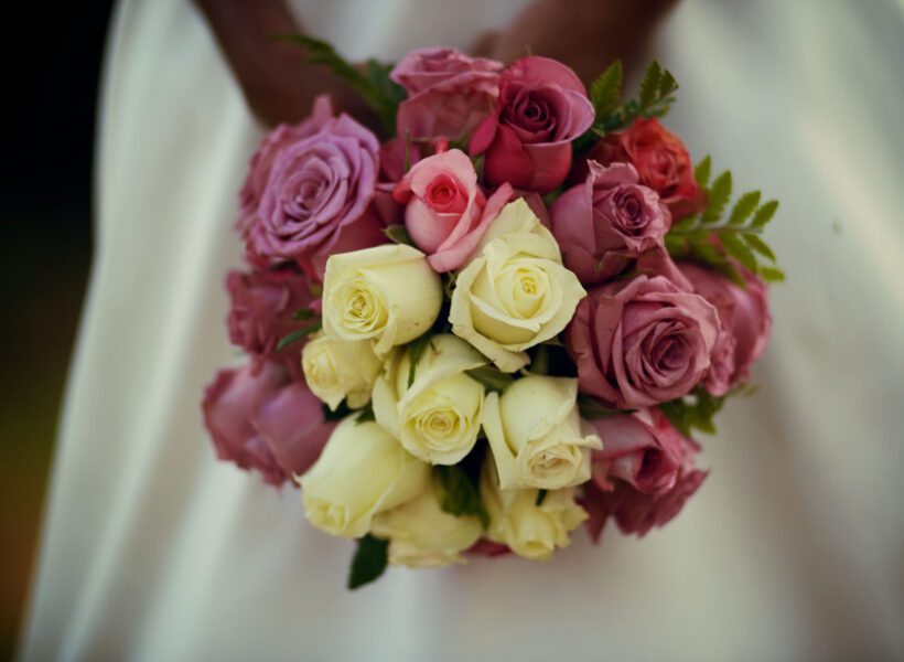 Woman holding a bouqet of flowers at Baraka Roses Ngorika.