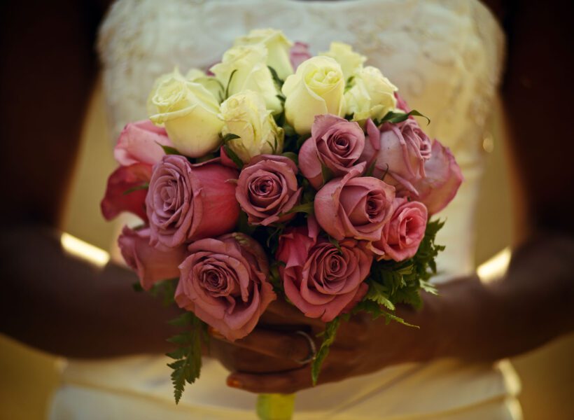 A woman holding a bouquet of flowers.